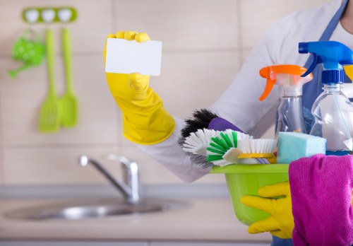 Workers performing after builders cleaning in a recently renovated room